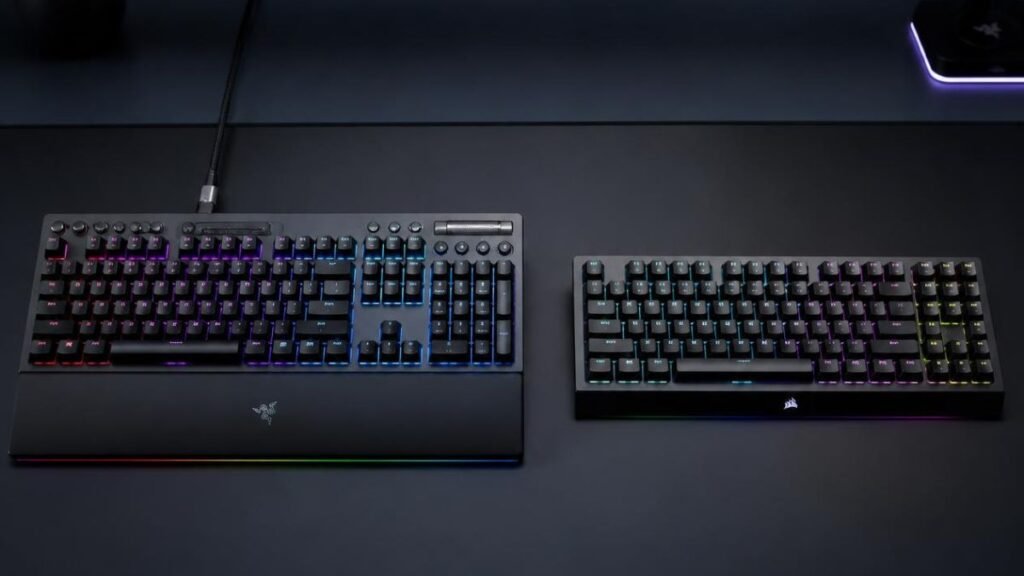 Gaming desk featuring a wireless keyboard with RGB lighting and gaming accessories